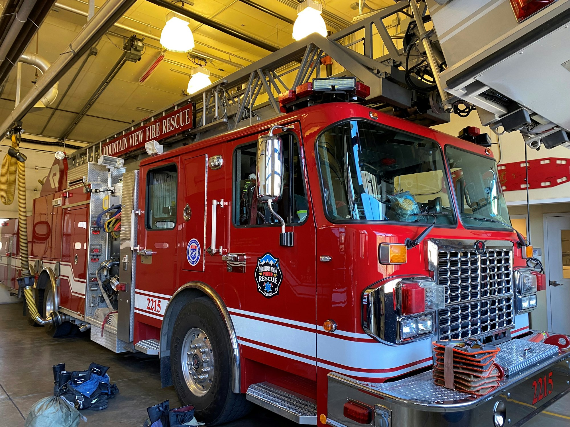 May contain: fire truck, transportation, truck, vehicle, lamp, bumper, accessories, bag, handbag, and person