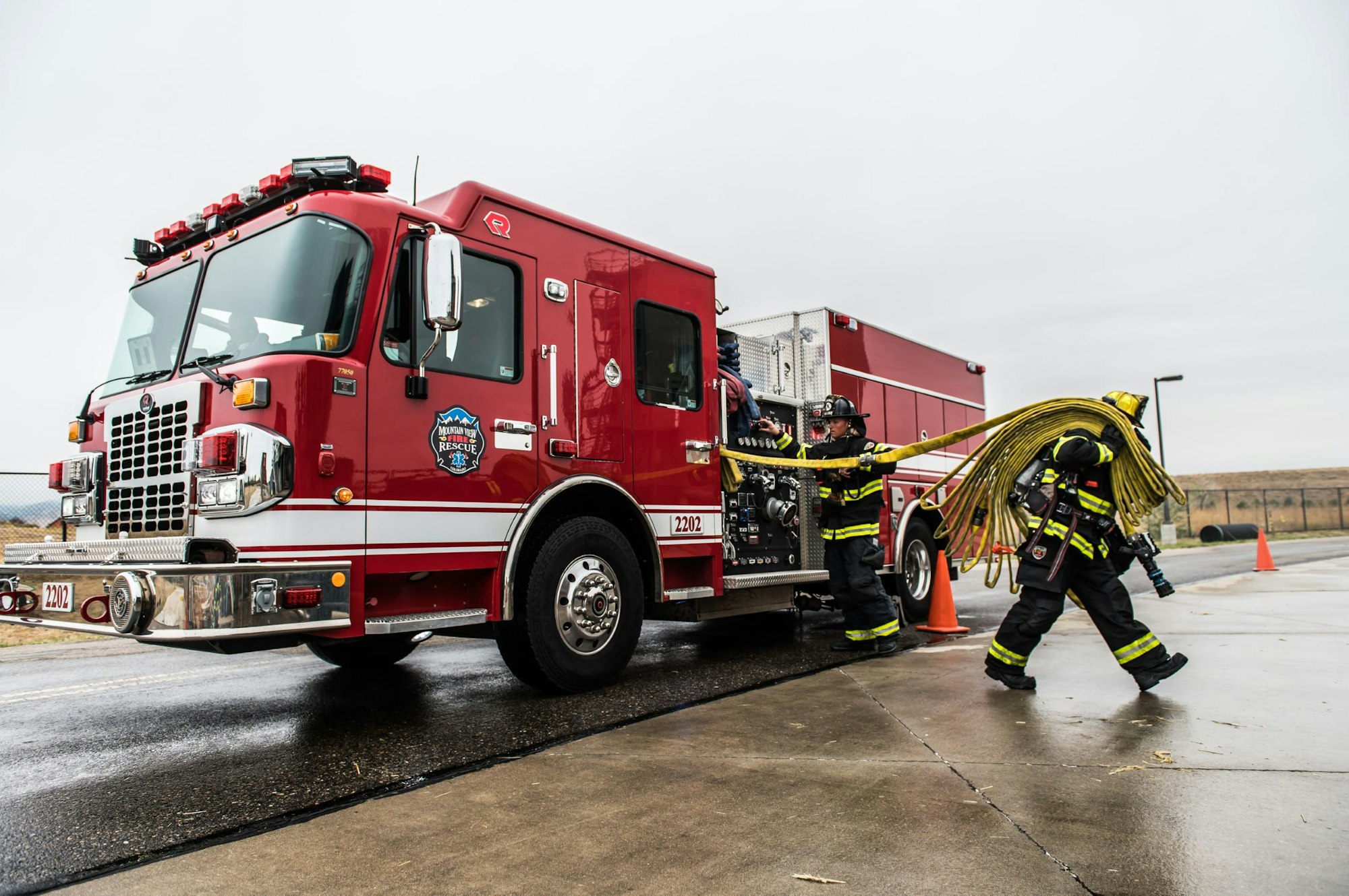 May contain: person, human, fire truck, truck, vehicle, and transportation