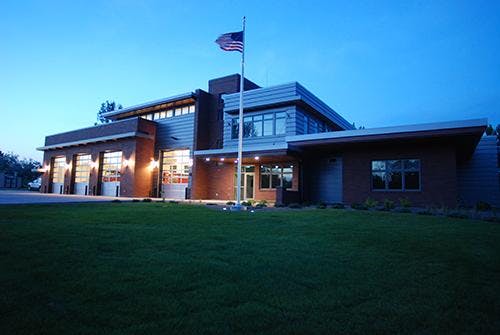 May contain: grass, plant, lawn, and building