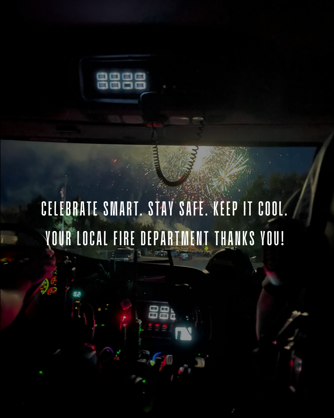 Inside a vehicle at night with fireworks outside; text: "Celebrate smart. Stay safe. Keep it cool. Your local fire department thanks you!"