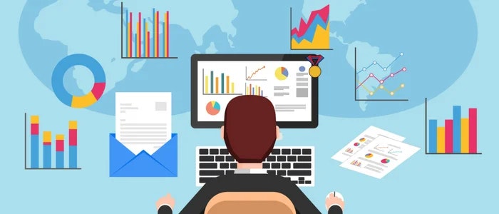 A person analyzes data on a computer amidst various charts, graphs, and documents, depicting data analysis and reporting.