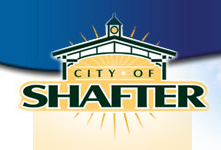Logo with the text "City of Shafter" under a stylized building design and a sunburst graphic in the background.