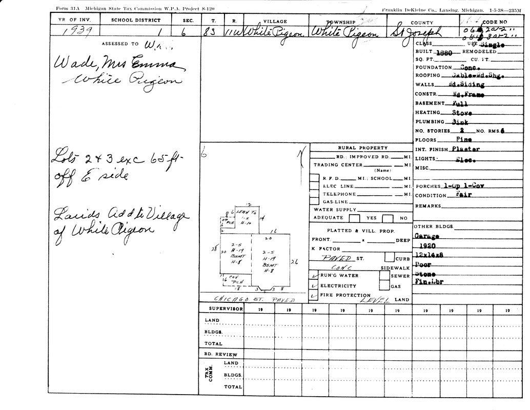 A tax form for a property in White Pigeon, Michigan, owned by Emma Wade. Features details on structure and land.