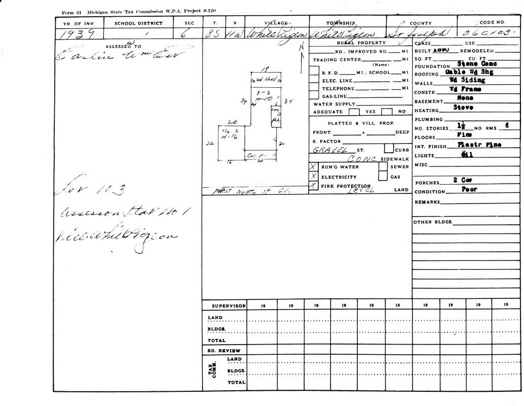 Property tax form from 1939 with handwritten notes, building specs, and utility details; assessed to Carlyle Timber.