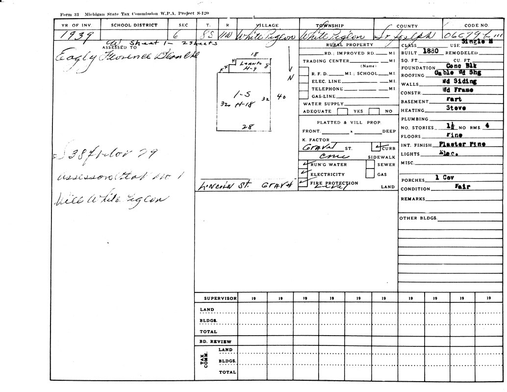 A 1939 Michigan property tax form for White Pigeon assessing a building from 1830 with wood siding, fair condition, and a stove.
