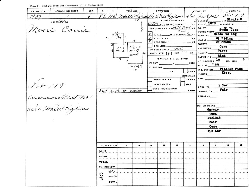 A 1939 property record for Carrie Moore, detailing a single house, lot 119, with specific building materials and conditions.