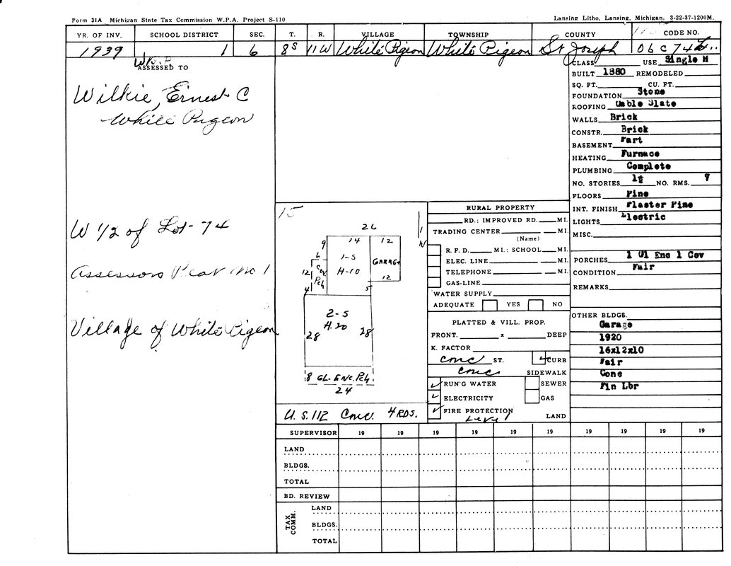 A 1939 property tax document detailing a building in White Pigeon, Michigan, including structural info and assessment details.