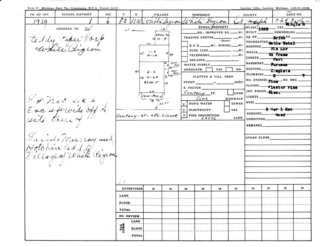 A 1939 property assessment form for Eddy Paper Corp in White Pigeon, Michigan, detailing building features and utilities.