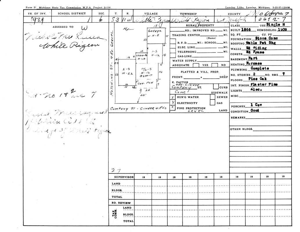 A 1939 Michigan tax document for a property in White Pigeon, detailing building specifications and ownership.