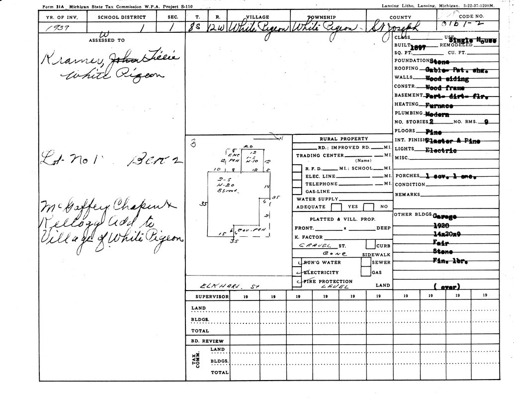 A 1939 property tax document for White Pigeon, Michigan. Details include land measurements, building specs, and owner's name.