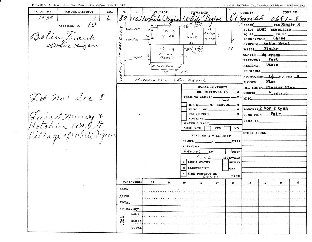 A 1939 Michigan property tax form for a building in White Pigeon, with details on structure, utilities, and ownership.