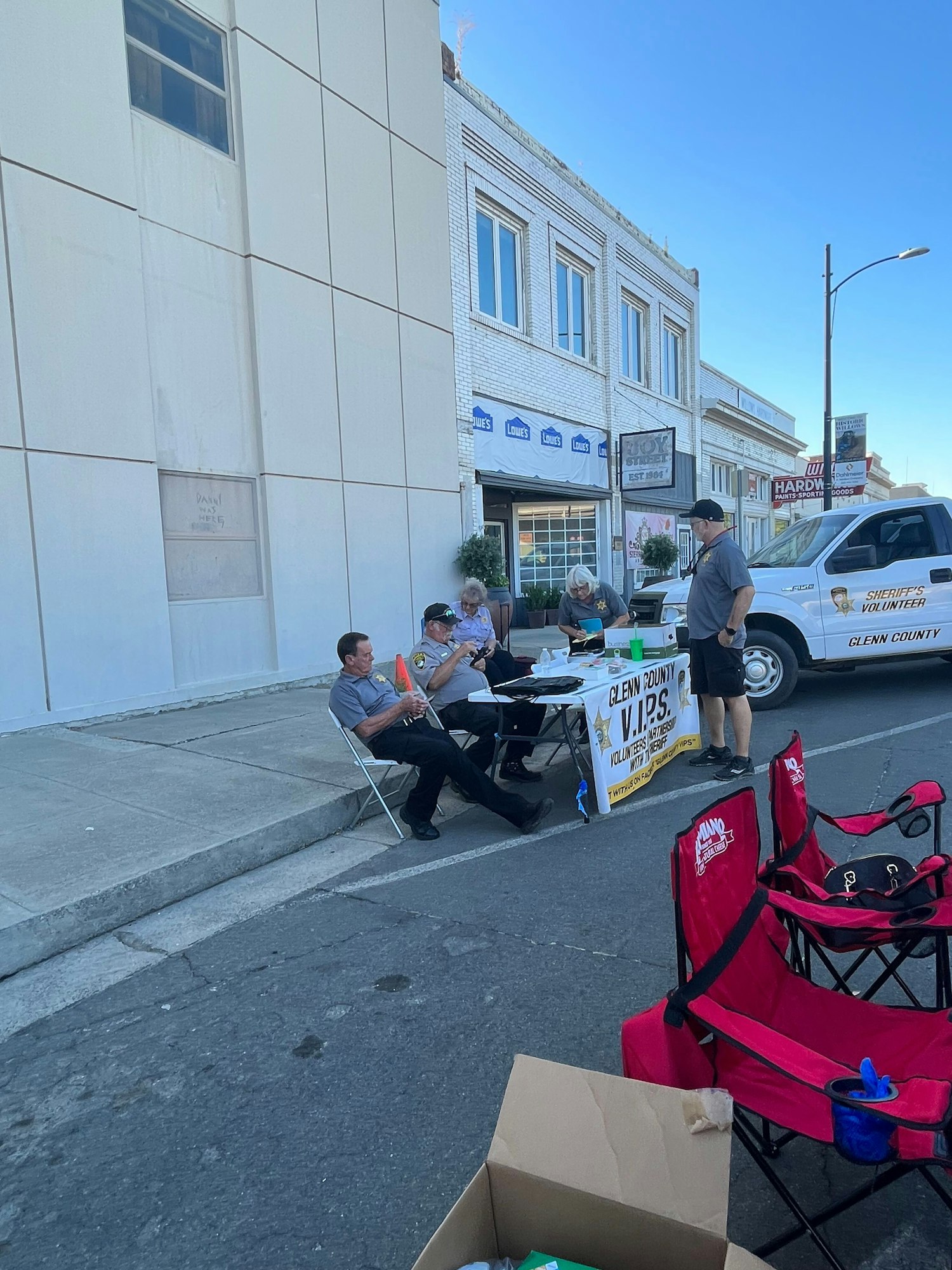 May contain: clothing, footwear, shoe, person, hat, adult, male, man, plant, wristwatch, car, transportation, vehicle, box, and urban