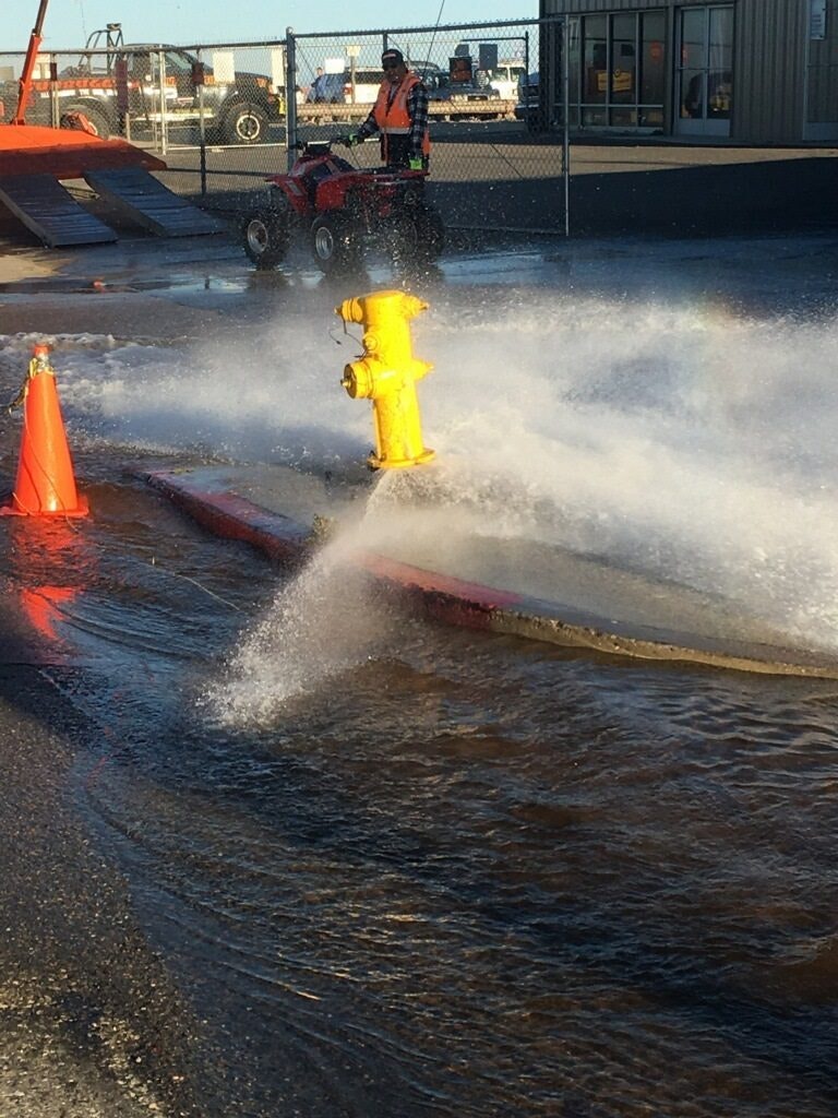 May contain: water, fire hydrant, hydrant, adult, male, man, person, machine, and wheel
