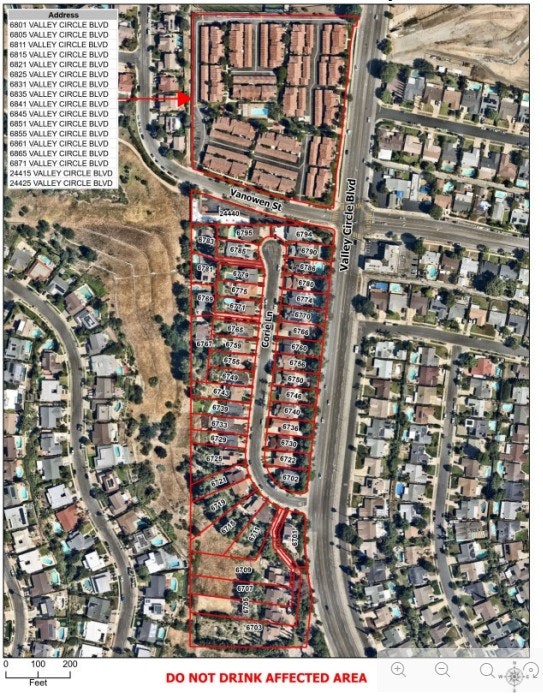 The image shows a map detailing addresses on Valley Circle Blvd with a warning: "DO NOT DRINK AFFECTED AREA."