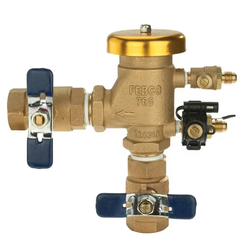 A brass sprinkler backflow preventer valve with two blue handles and a gold cap.