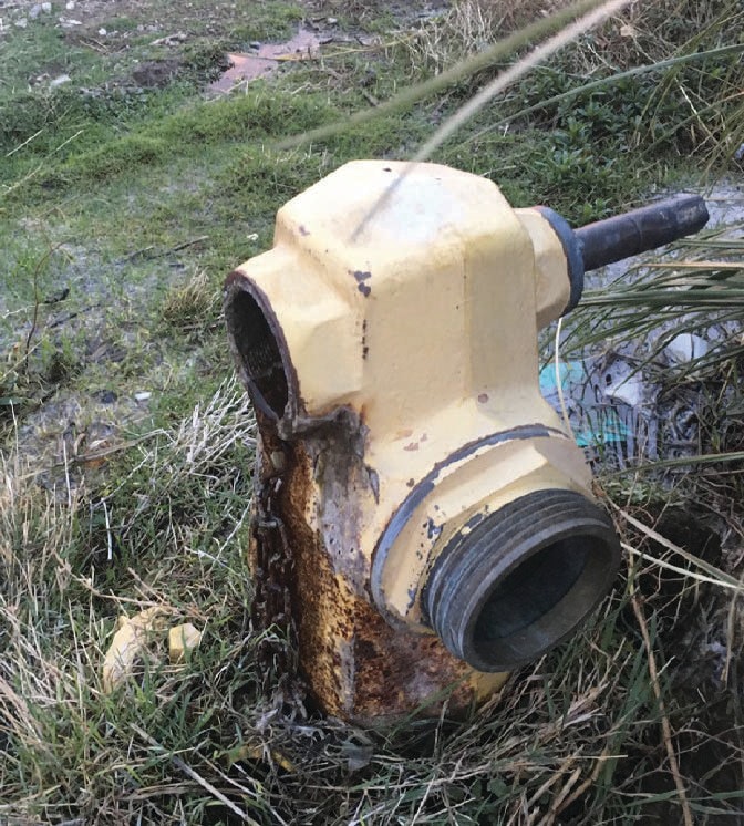 A damaged fire hydrant from unauthorized and improper use.