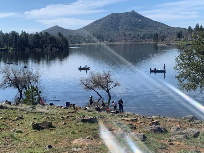 May contain: nature, outdoors, scenery, boat, canoe, canoeing, leisure activities, person, rowboat, sport, transportation, vehicle, water, water sports, lake, and lakefront