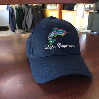A navy cap with a colorful fish and "Lake Cuyamaca" embroidered on it.