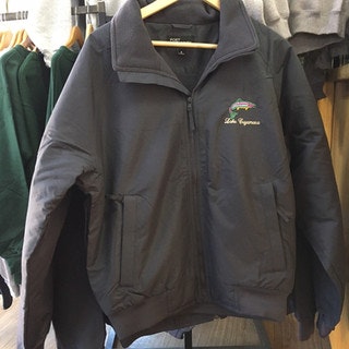 A dark jacket on a hanger with "Lake Capasus" and a logo embroidered on it.