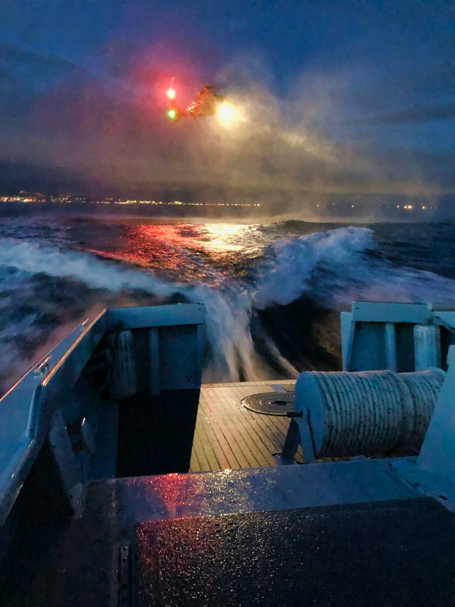 Picture is of a nigh-time helicopter drill with the United States Coast Guard