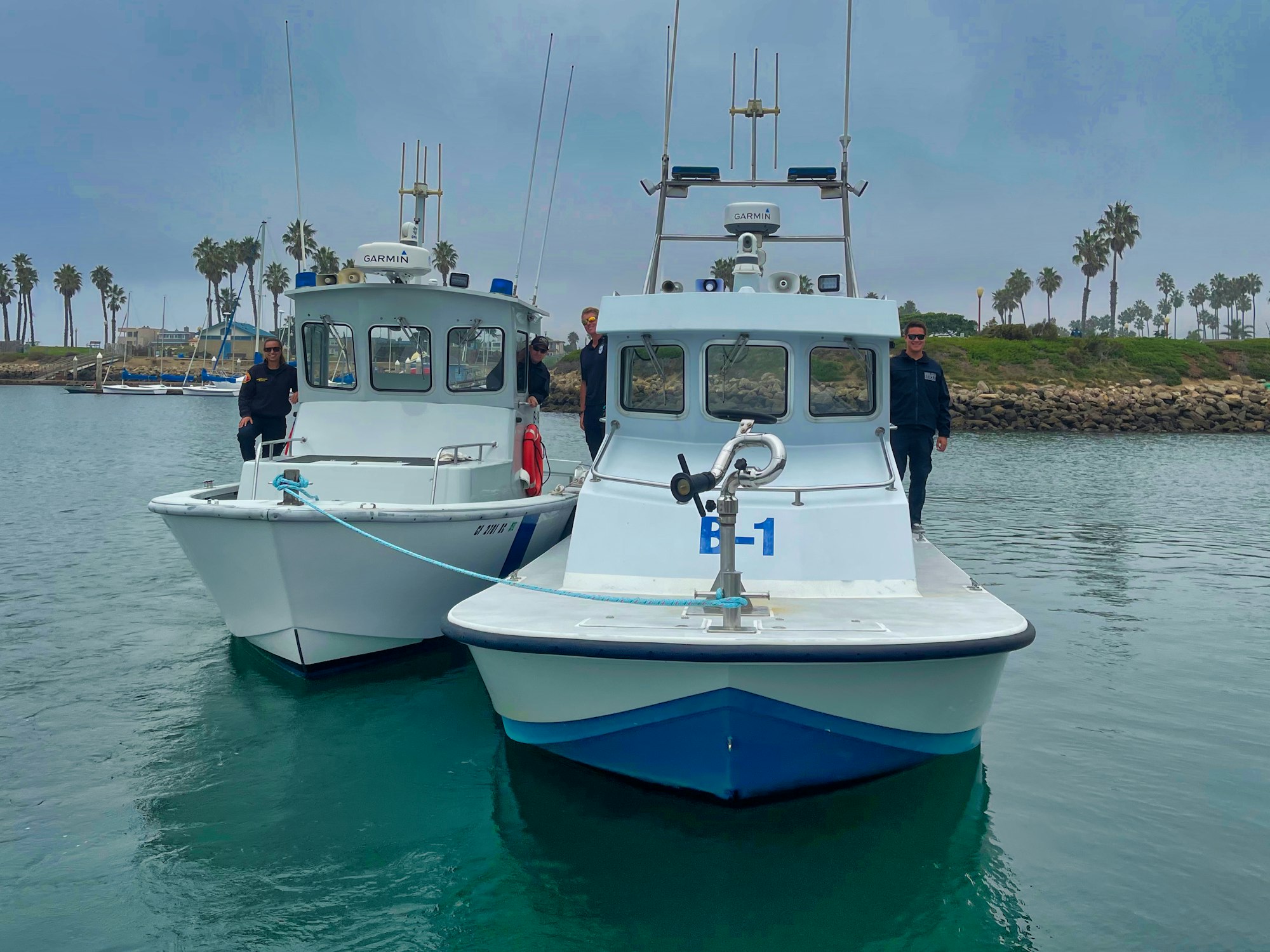 Harbor Patrol Staff on two boats.  Practicing towing