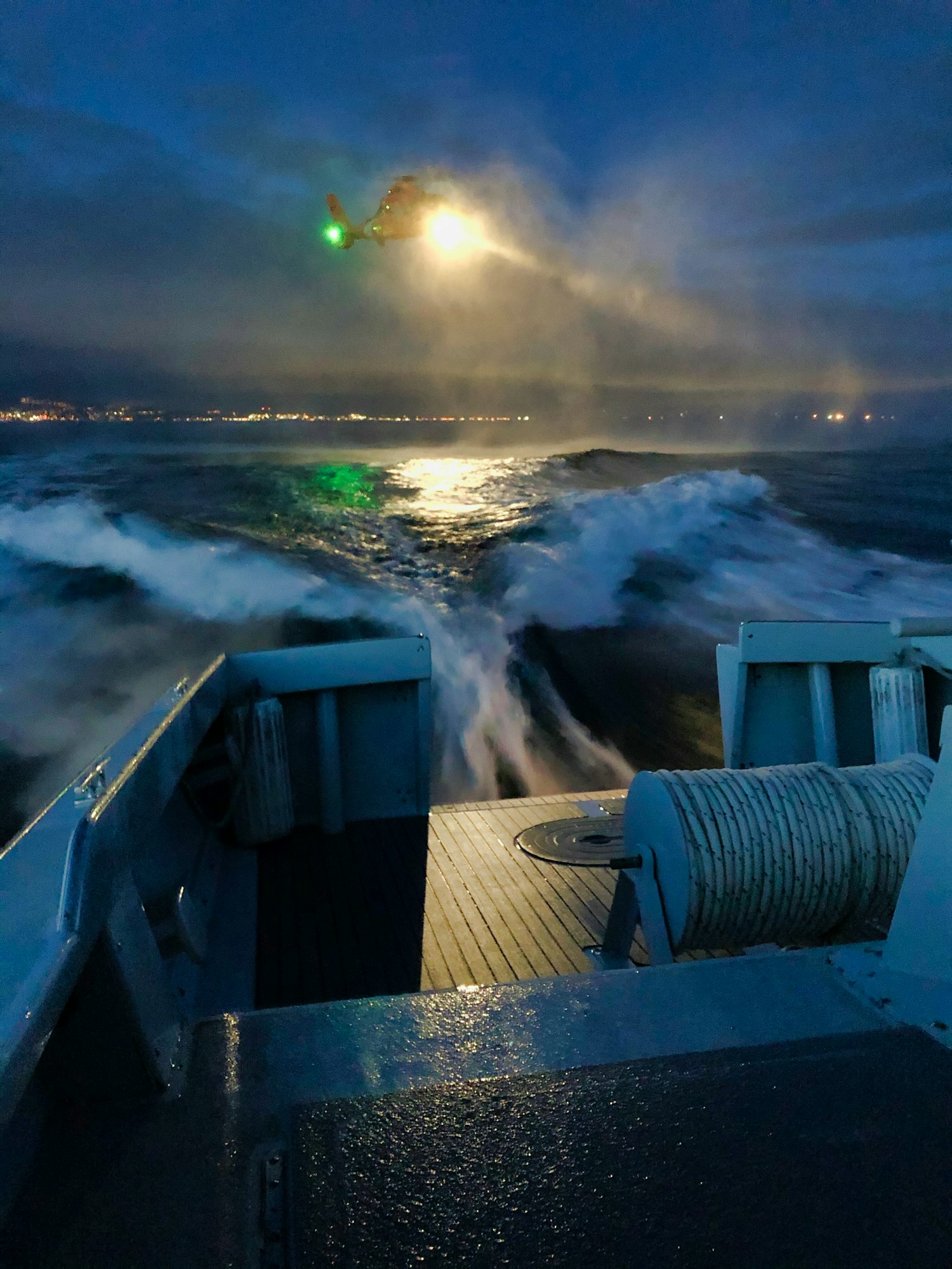 Picture is of a nigh-time helicopter drill with the United States Coast Guard