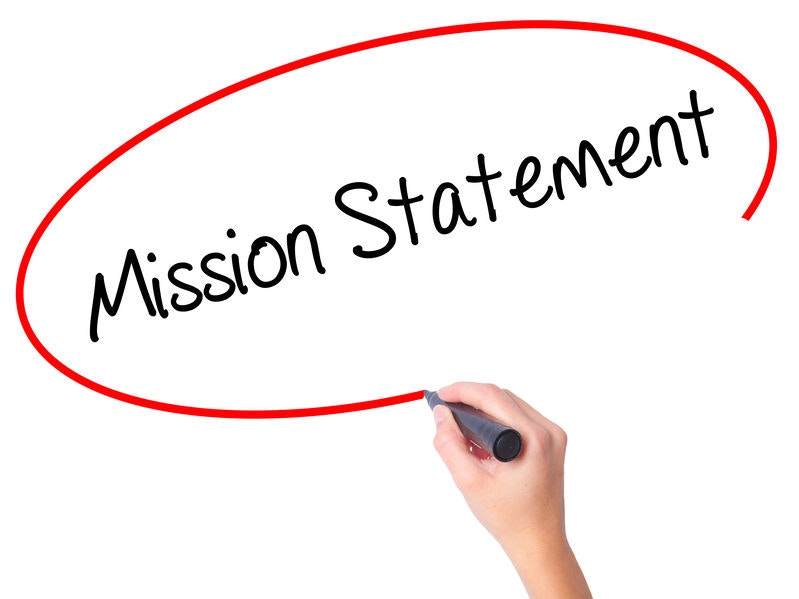 A hand writing "Mission Statement" inside a red outlined ellipse.