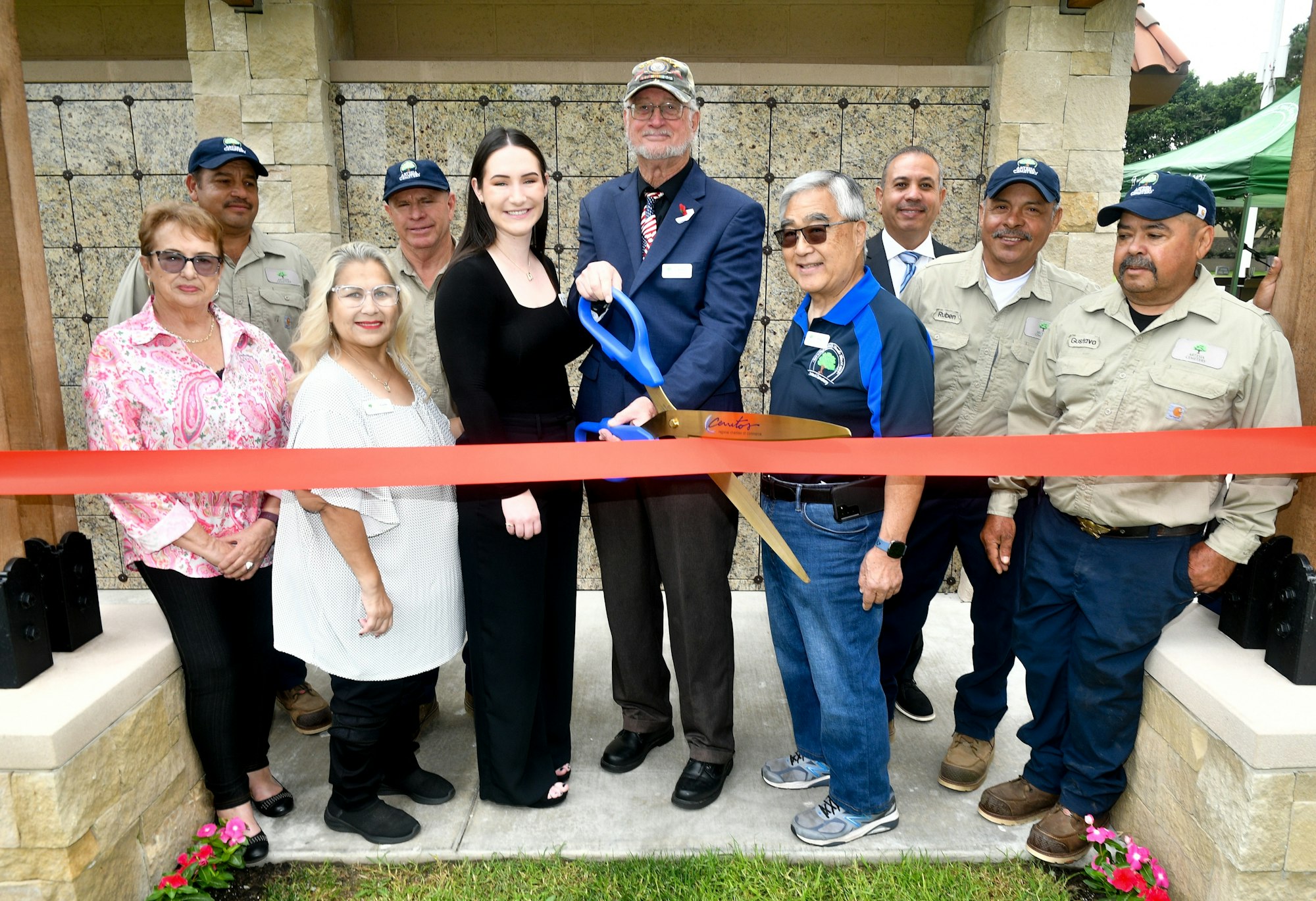 Group of people at a ribbon-cutting ceremony.