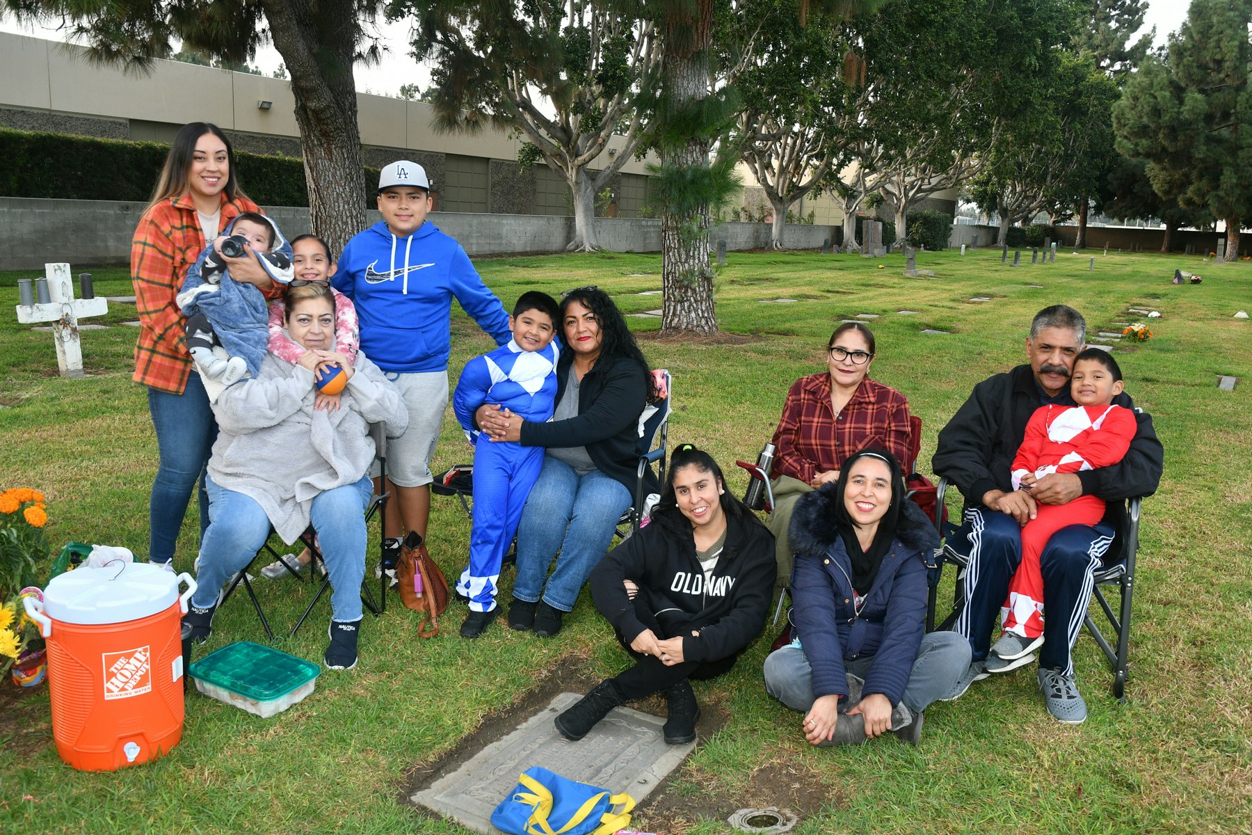 Family gathered around the grave of their love one