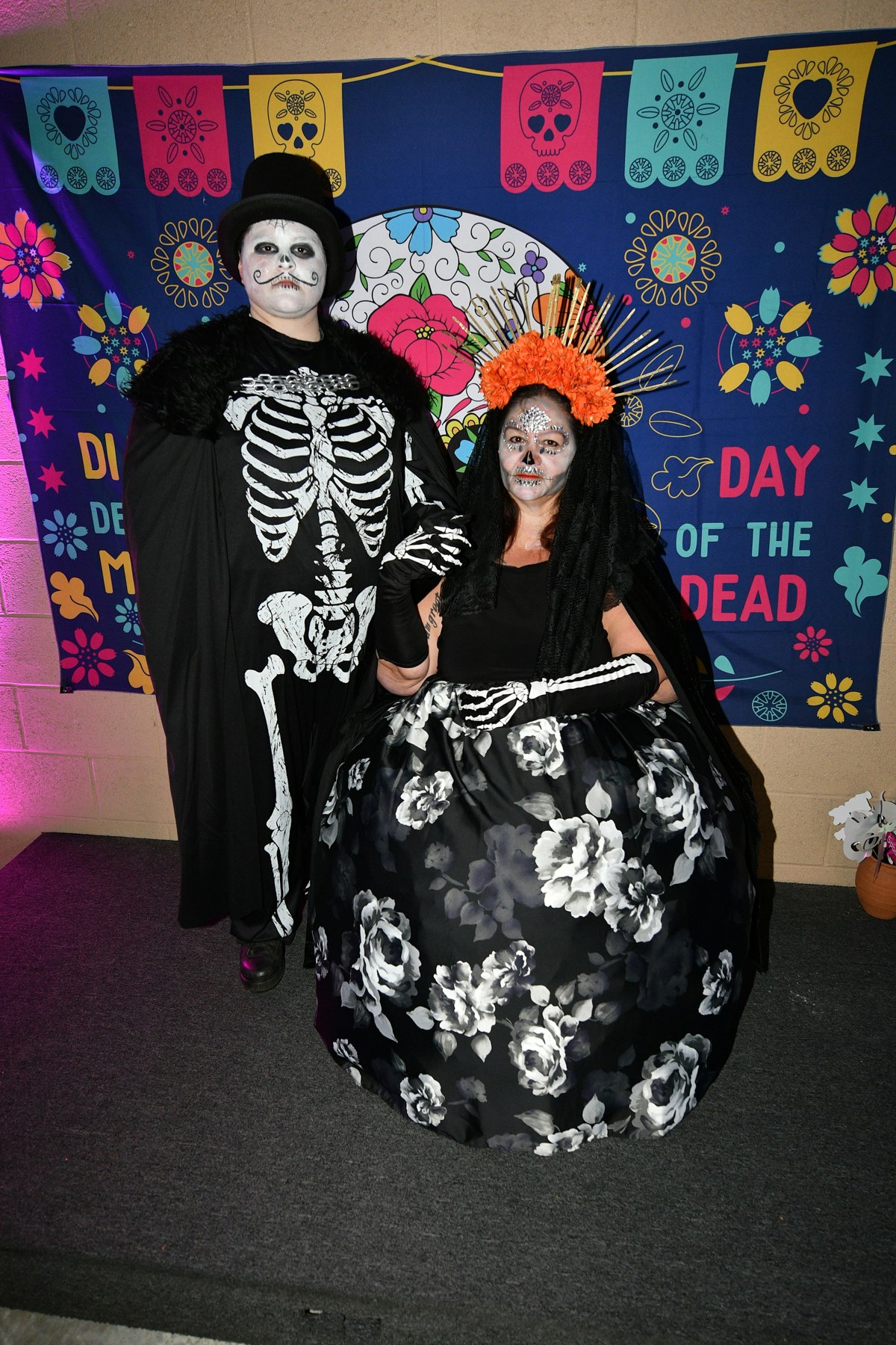 Older couple dressed up for Dia de los Muertos