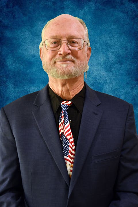 May contain: tie, accessory, accessories, coat, apparel, clothing, overcoat, suit, person, human, and necktie