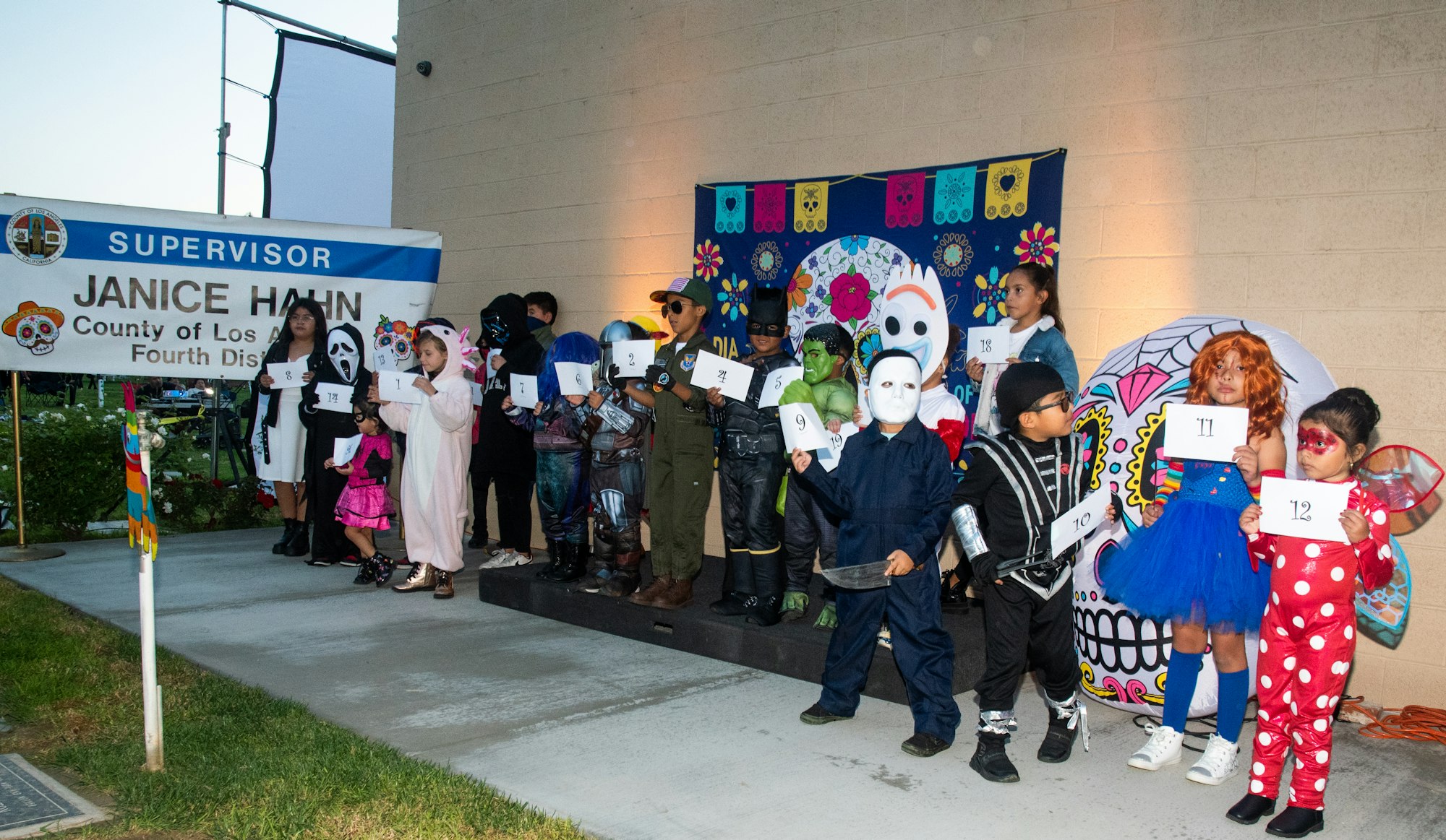 May contain: shoe, footwear, clothing, glove, person, child, girl, female, pants, boy, male, costume, glasses, and accessories