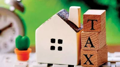 The image features a small house model next to wooden blocks spelling "TAX," set against a green background.