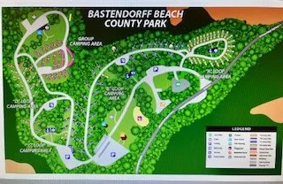 Map of Bastendorff Beach County Park showing camp areas, trails, and park layout. Includes a legend for site identification.