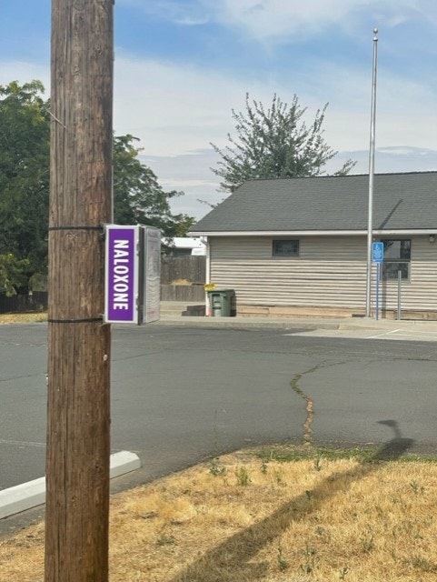 May contain: city, road, street, urban, utility pole, bus stop, and outdoors