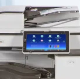 An office multifunction printer/copier with a touchscreen control panel.