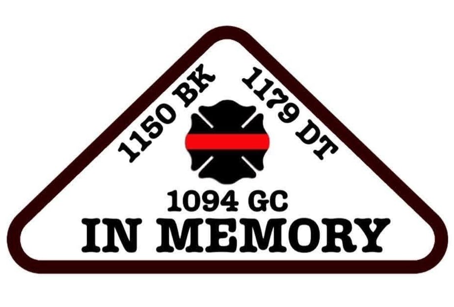Triangular emblem with "1150 BK," "1179 DT," "1094 GC," firefighter symbol, and "IN MEMORY" text.