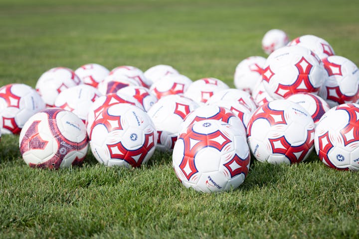 May contain: ball, football, soccer, soccer ball, sport, helmet, and sphere