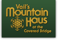A logo for "Vail's Mountain Haus at the Covered Bridge" with a snowflake design.