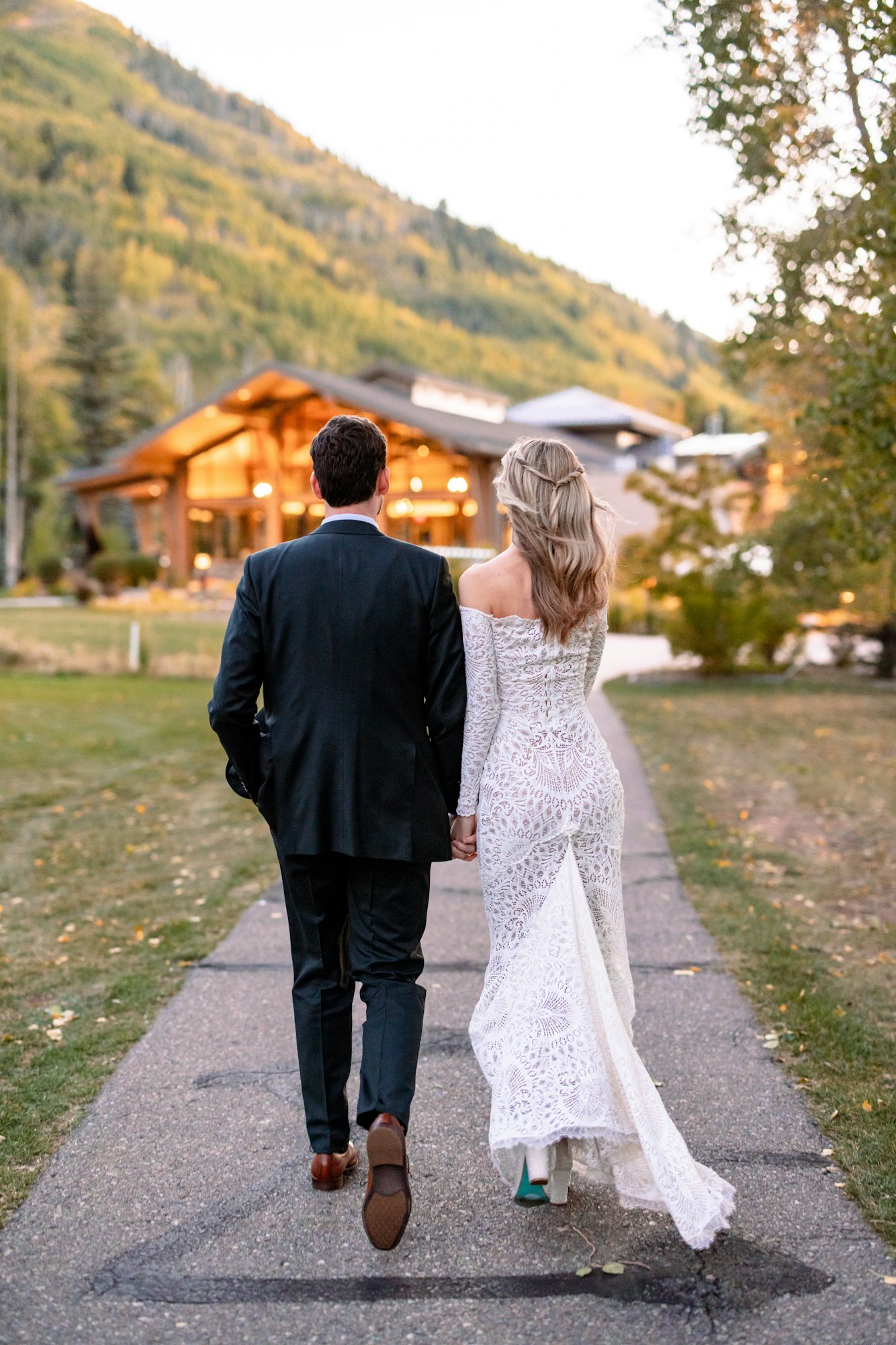 May contain: clothing, dress, person, pants, blazer, coat, jacket, body part, hand, adult, male, man, walking, formal wear, fashion, and gown