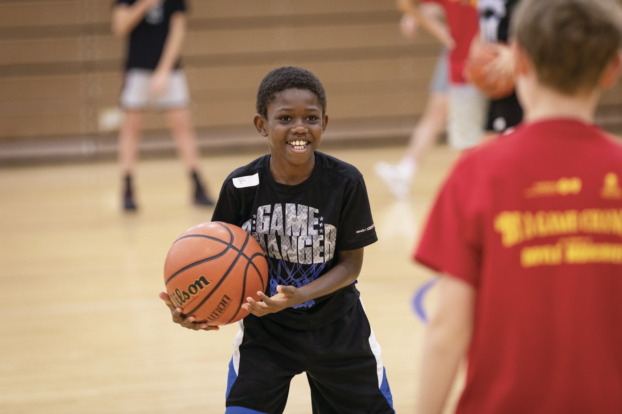 Smiling boy holding a basketball