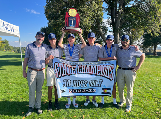 Group of people celebrating a high school state championship in boys' golf for the 2022-23 season.