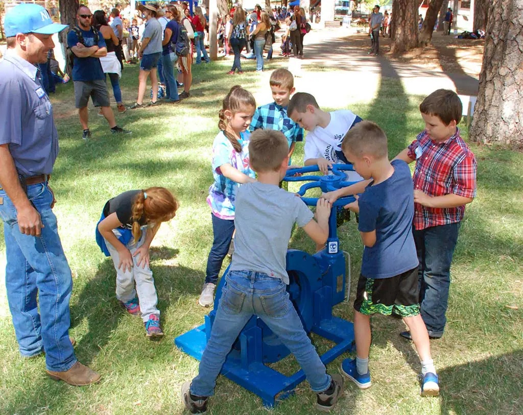 children playing with farm equipment