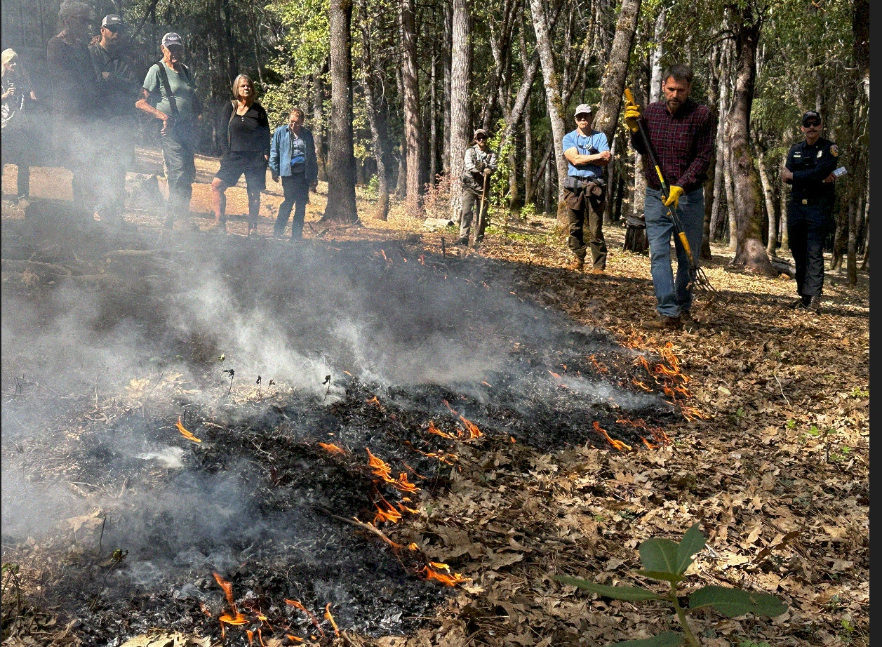 May contain: person, clothing, glove, adult, male, man, and fire