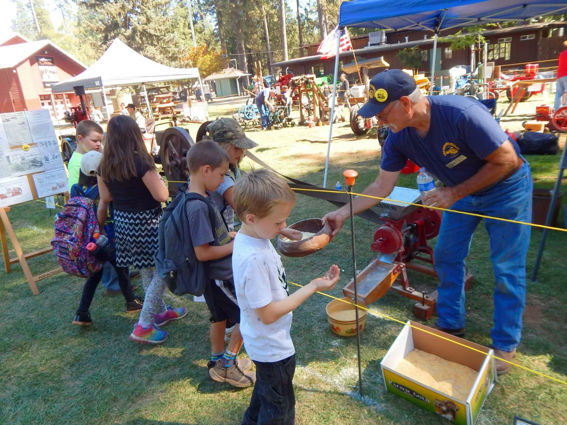 children at an event booth