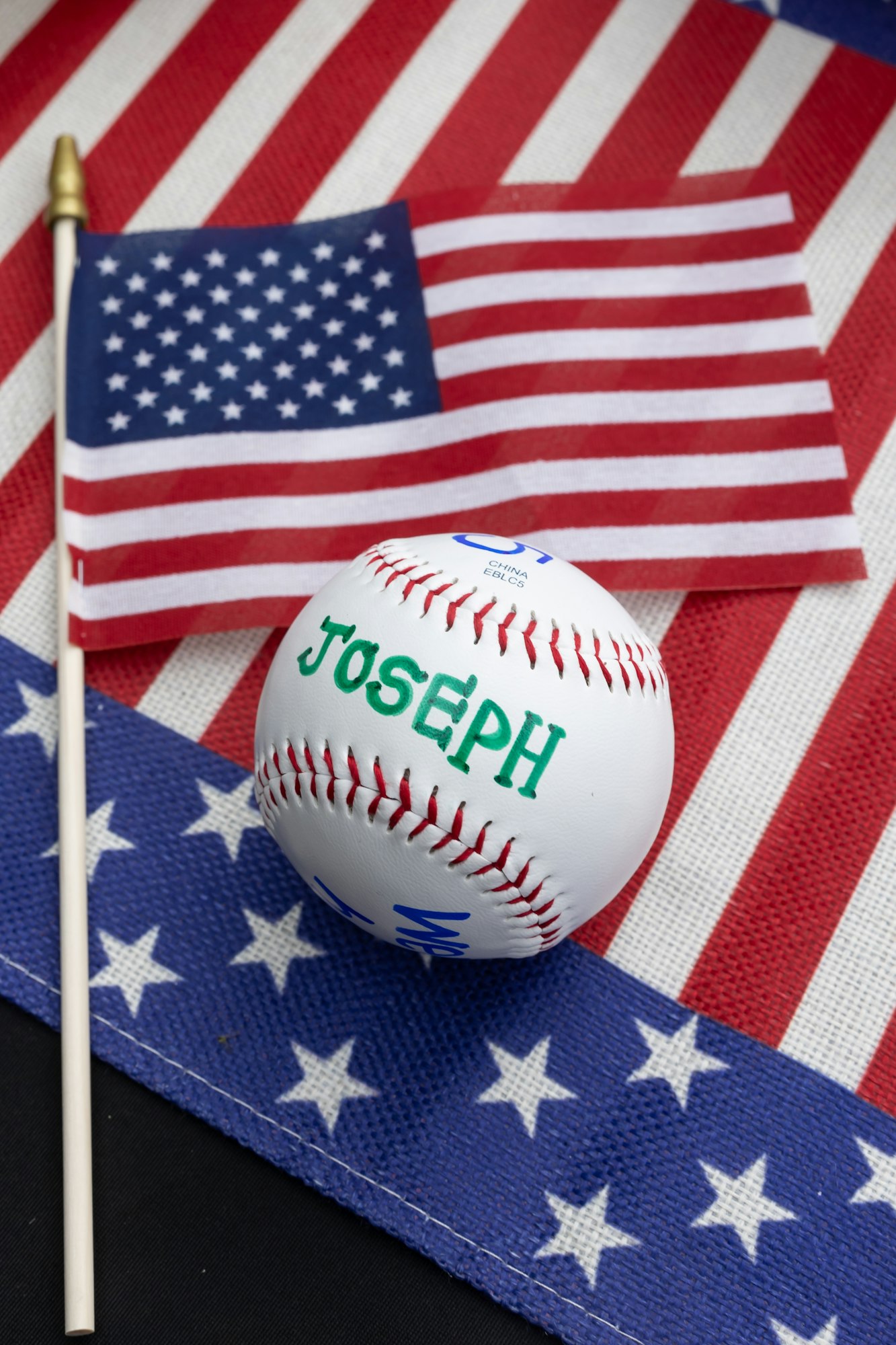 May contain: ball, baseball, baseball (ball), sport, american flag, and flag