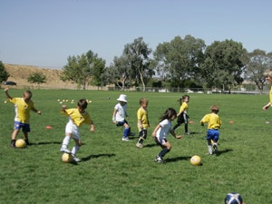 May contain: person, human, people, ball, team, soccer, soccer ball, sports, team sport, football, and sport