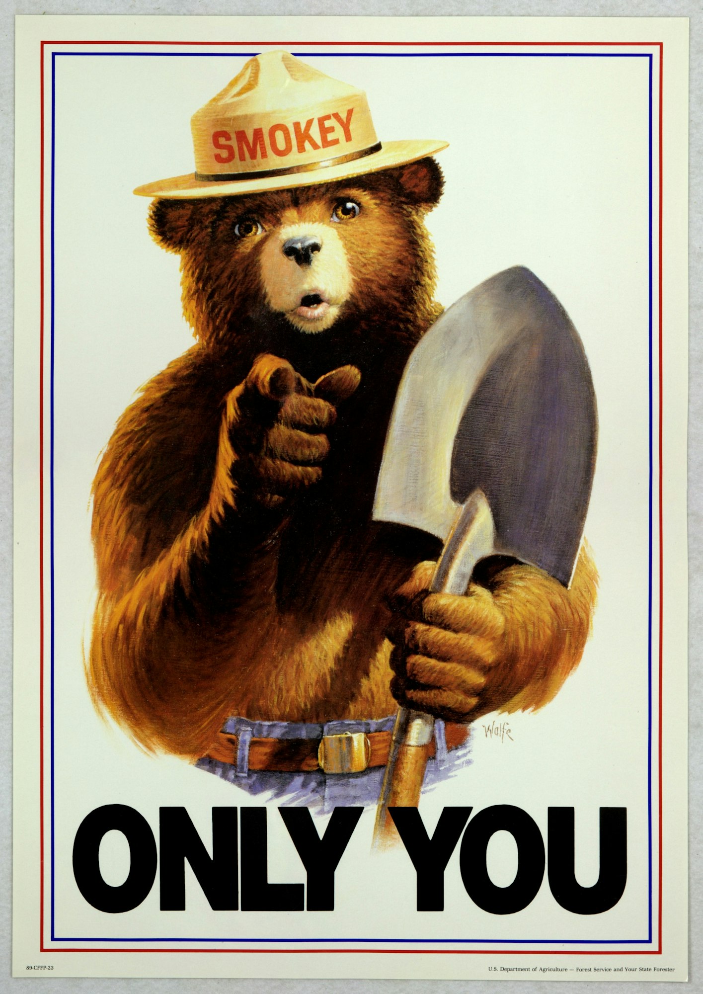 A bear in a hat holding a shovel, pointing, with "SMOKEY" on the hat and "ONLY YOU" text below.