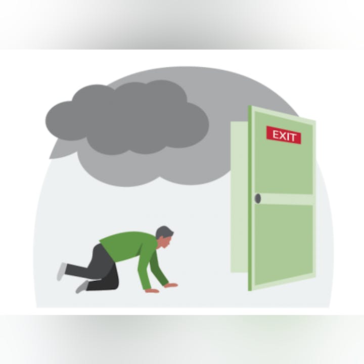 A person is crawling on the floor toward an open exit door, with smoke above.