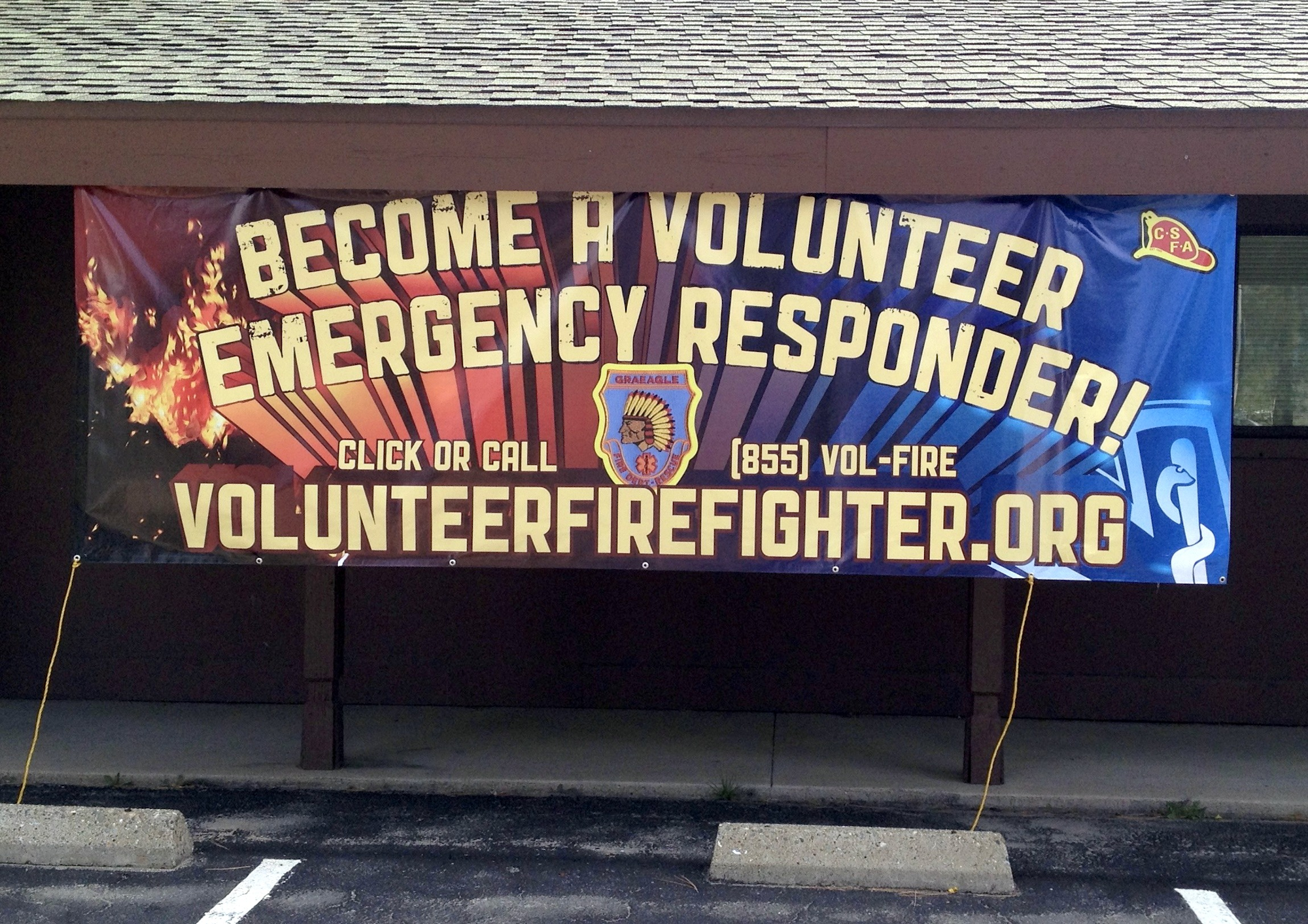 A banner promoting volunteer emergency responders with contact info.